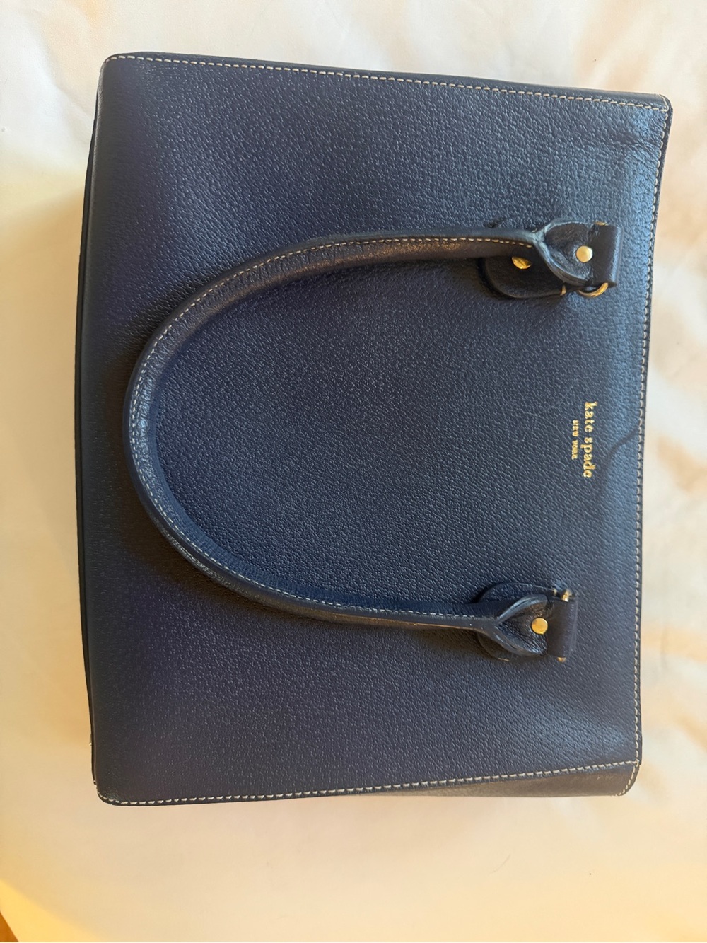 Kate Spade navy pebbled leather satchel with gold logo